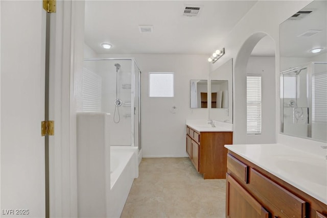 9190 Wine Cellar Ave, Las Vegas, NV 89148 - full bath featuring a stall shower, two vanities, and a bath