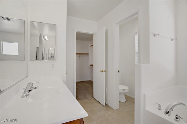 9190 Wine Cellar Ave, Las Vegas, NV 89148 - full bath with vanity, a bath, toilet, tile patterned floors, and plenty of natural light