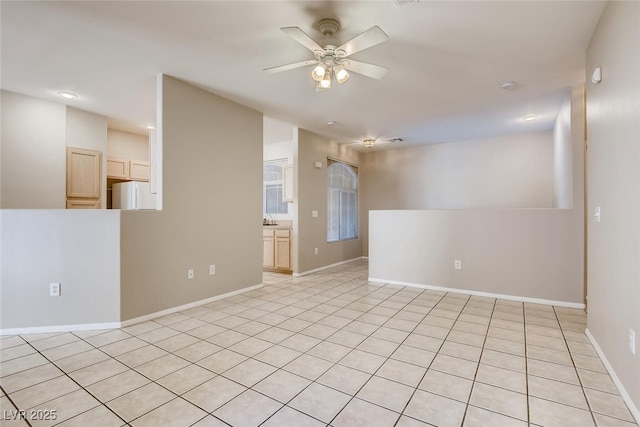 1713 Sky Of Red Dr Unit 203, Las Vegas, NV 89128 - unfurnished room featuring a ceiling fan, baseboards, light tile patterned floors, and recessed lighting