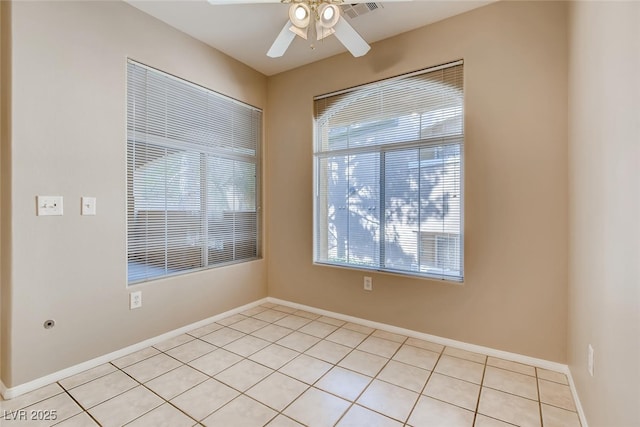 1713 Sky Of Red Dr Unit 203, Las Vegas, NV 89128 - spare room with light tile patterned flooring, a ceiling fan, and baseboards