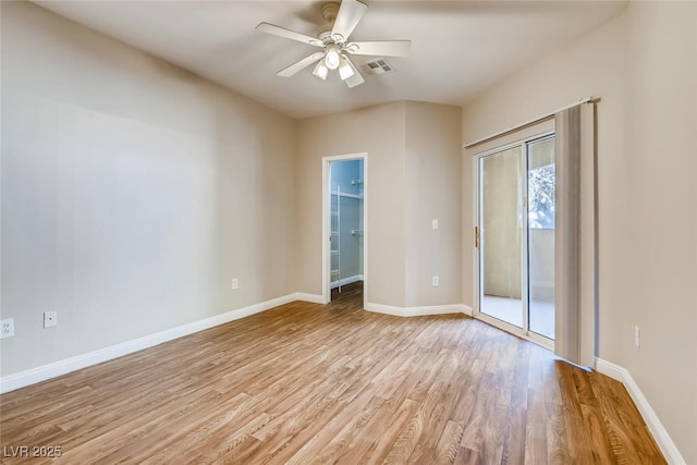 1713 Sky Of Red Dr Unit 203, Las Vegas, NV 89128 - spare room featuring light wood-style floors, ceiling fan, and baseboards