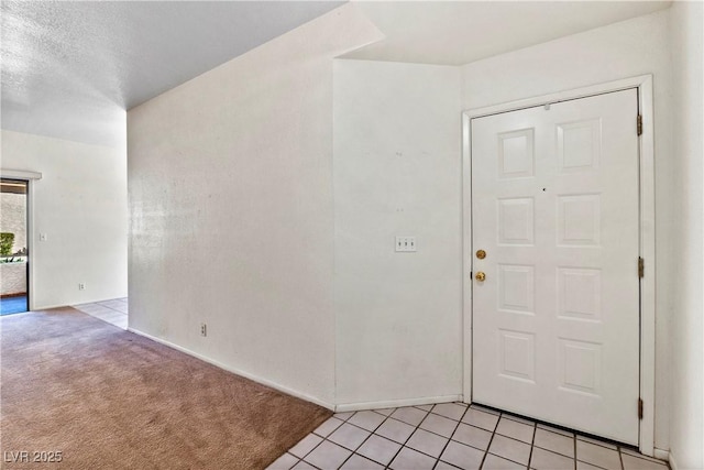 3827 Desert Marina Dr Unit 211, Laughlin, NV 89029 - entrance foyer featuring light carpet, baseboards, and light tile patterned floors
