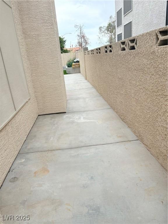 5040 Jacarilla Ln, North Las Vegas, NV 89031 - fenced backyard featuring a patio area