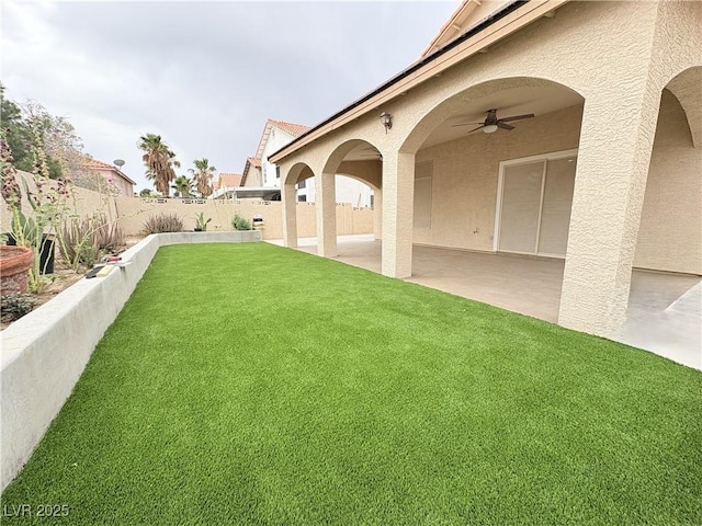 5040 Jacarilla Ln, North Las Vegas, NV 89031 - view of yard featuring a ceiling fan and a patio area