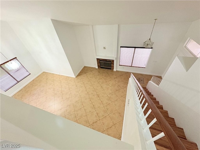 5040 Jacarilla Ln, North Las Vegas, NV 89031 - unfurnished living room featuring stairs and light tile patterned floors
