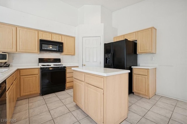 4323 Village Spring St, Las Vegas, NV 89147 - kitchen featuring black appliances, light brown cabinetry, light tile patterned flooring, and a towering ceiling