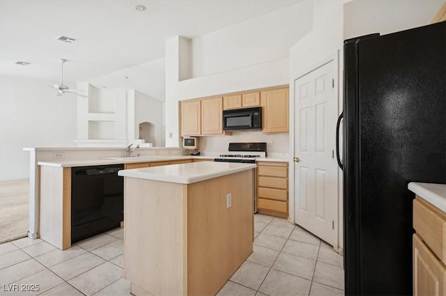4323 Village Spring St, Las Vegas, NV 89147 - kitchen with black appliances, light brown cabinetry, a sink, a ceiling fan, and a center island