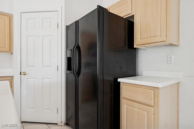4323 Village Spring St, Las Vegas, NV 89147 - kitchen featuring black refrigerator with ice dispenser, light brown cabinets, light countertops, and light tile patterned flooring