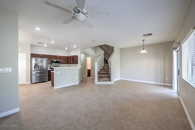 1554 Ward Frontier Ln, Henderson, NV 89002 - unfurnished living room with ceiling fan, baseboards, stairway, and recessed lighting