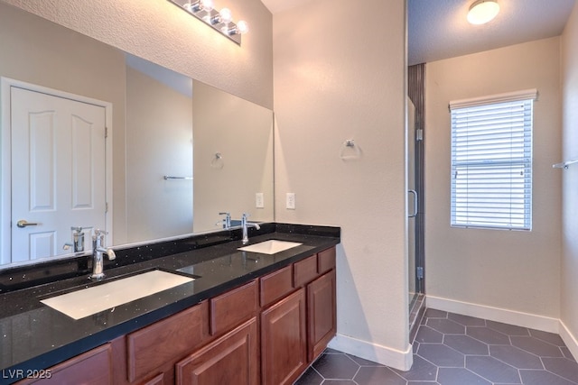 1554 Ward Frontier Ln, Henderson, NV 89002 - full bath with healthy amount of natural light, double vanity, a shower stall, and baseboards
