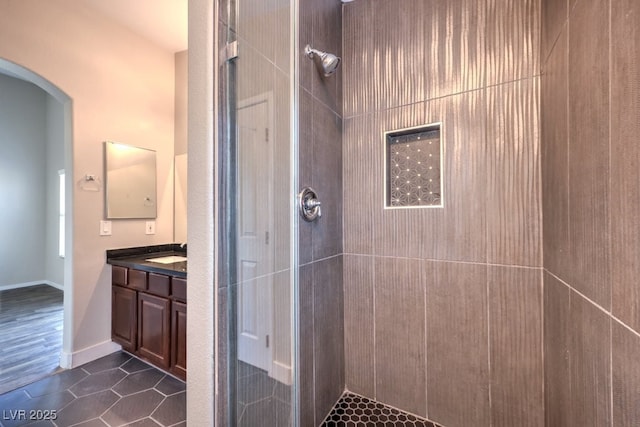 1554 Ward Frontier Ln, Henderson, NV 89002 - bathroom featuring a tile shower, vanity, and tile patterned floors