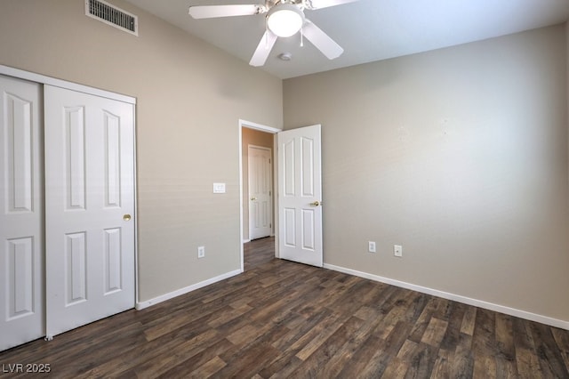 1554 Ward Frontier Ln, Henderson, NV 89002 - unfurnished bedroom with baseboards, dark wood-style flooring, a closet, lofted ceiling, and ceiling fan