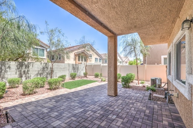 1554 Ward Frontier Ln, Henderson, NV 89002 - fenced backyard with a patio and central air condition unit
