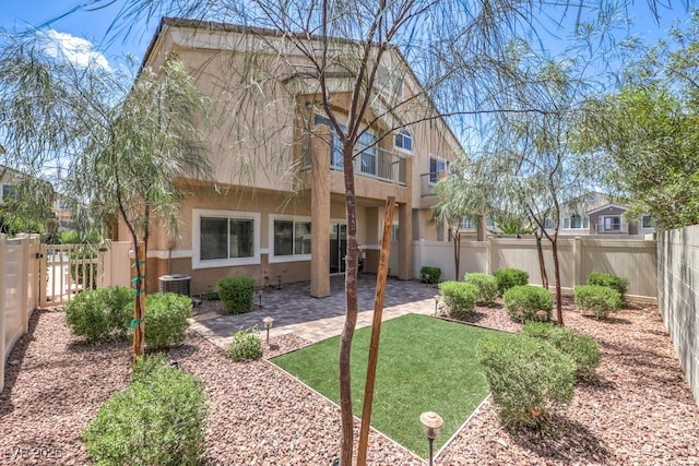 1554 Ward Frontier Ln, Henderson, NV 89002 - rear view of property featuring stucco siding and cooling unit