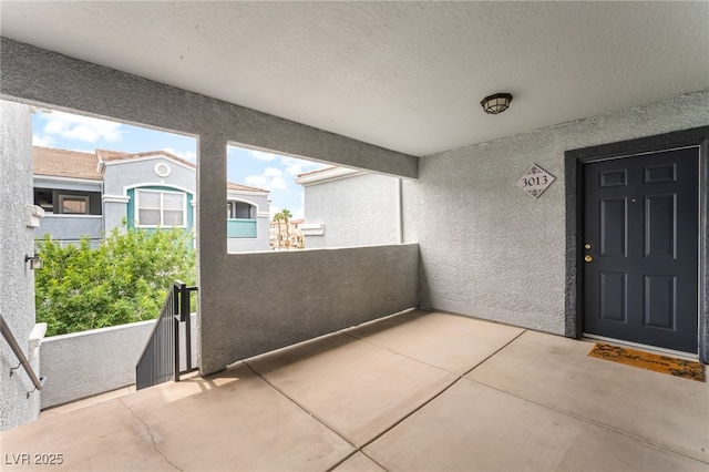 6955 N Durango Dr Unit 3013, Las Vegas, NV 89149 - view of exterior entry featuring stucco siding and a balcony