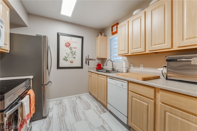 6955 N Durango Dr Unit 3013, Las Vegas, NV 89149 - kitchen featuring white appliances, a sink, and light brown cabinetry