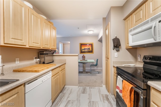6955 N Durango Dr Unit 3013, Las Vegas, NV 89149 - kitchen with white appliances, light brown cabinets, light countertops, and light marble finish floors