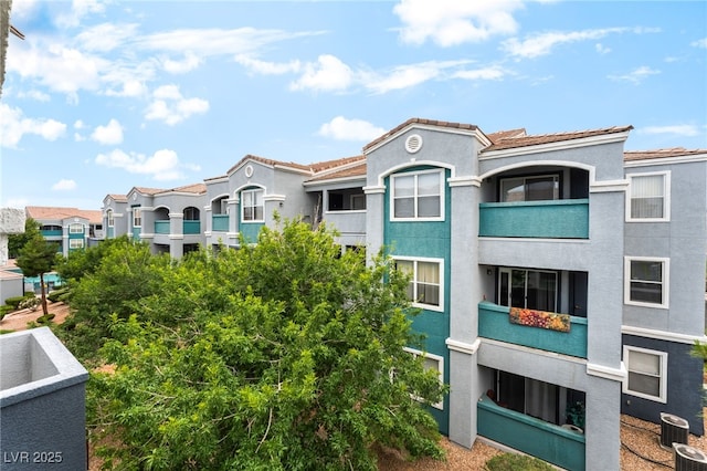6955 N Durango Dr Unit 3013, Las Vegas, NV 89149 - view of building exterior with cooling unit and a residential view