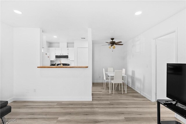 3923 Gogo Way Unit 106, Las Vegas, NV 89103 - living room with ceiling fan, light wood-style floors, recessed lighting, and baseboards