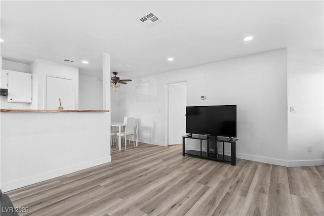 3923 Gogo Way Unit 106, Las Vegas, NV 89103 - unfurnished living room featuring light wood finished floors, recessed lighting, baseboards, and ceiling fan