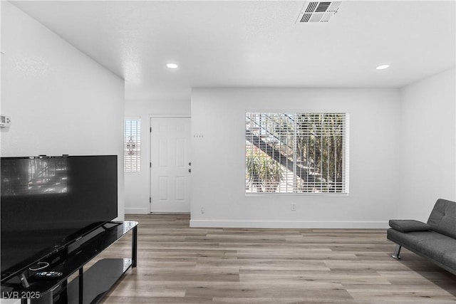 3923 Gogo Way Unit 106, Las Vegas, NV 89103 - sitting room with healthy amount of natural light, wood finished floors, recessed lighting, and baseboards