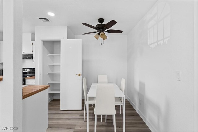 3923 Gogo Way Unit 106, Las Vegas, NV 89103 - dining room featuring wood finished floors and ceiling fan