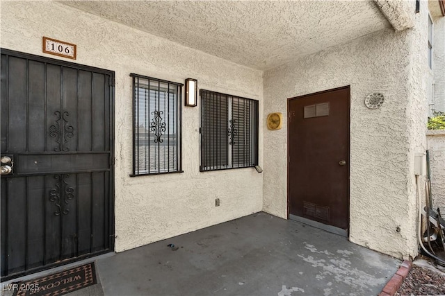 3923 Gogo Way Unit 106, Las Vegas, NV 89103 - doorway to property featuring stucco siding and a patio area