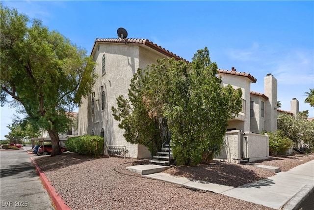 3923 Gogo Way Unit 106, Las Vegas, NV 89103 - view of front of property with stucco siding and a tiled roof
