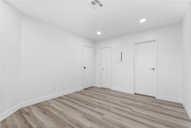 3923 Gogo Way Unit 106, Las Vegas, NV 89103 - unfurnished bedroom with light wood-type flooring, recessed lighting, and baseboards