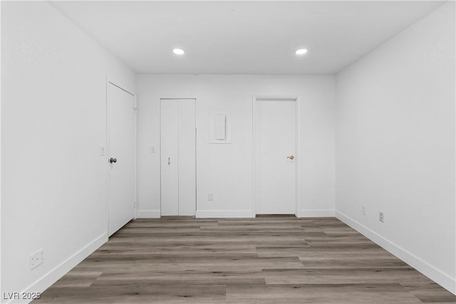 3923 Gogo Way Unit 106, Las Vegas, NV 89103 - unfurnished room with recessed lighting, wood finished floors, and baseboards