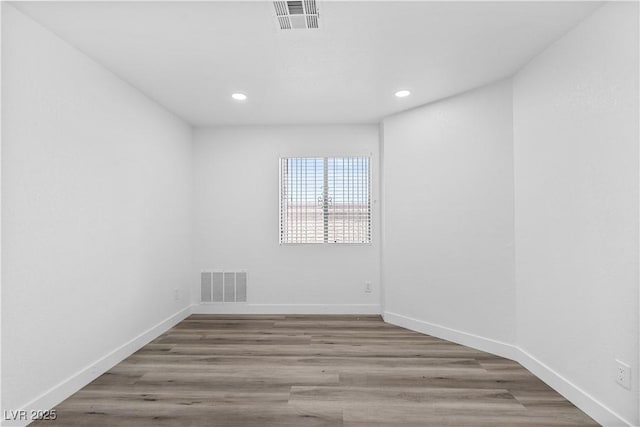3923 Gogo Way Unit 106, Las Vegas, NV 89103 - empty room featuring recessed lighting, baseboards, and wood finished floors
