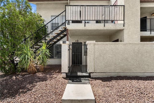 3923 Gogo Way Unit 106, Las Vegas, NV 89103 - property entrance with stucco siding and a gate