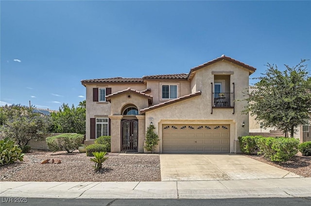 1667 Sabatini Dr, Henderson, NV 89052 - mediterranean / spanish home with a balcony, a tiled roof, driveway, stucco siding, and a garage