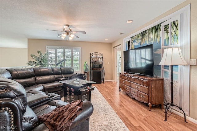 1667 Sabatini Dr, Henderson, NV 89052 - living room featuring a ceiling fan, light wood-style floors, baseboards, and recessed lighting