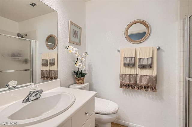 1667 Sabatini Dr, Henderson, NV 89052 - bathroom with toilet, an enclosed shower, and vanity