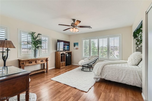 1667 Sabatini Dr, Henderson, NV 89052 - bedroom with wood finished floors, baseboards, and a ceiling fan