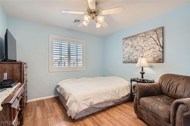1667 Sabatini Dr, Henderson, NV 89052 - bedroom featuring light wood-style floors, baseboards, and a ceiling fan