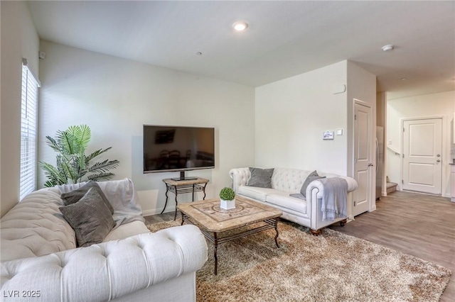12728 Feathersong St, Henderson, NV 89044 - living area featuring wood finished floors and baseboards