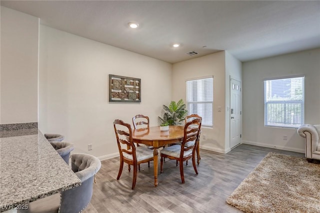 12728 Feathersong St, Henderson, NV 89044 - dining space with baseboards, light wood-style floors, and recessed lighting