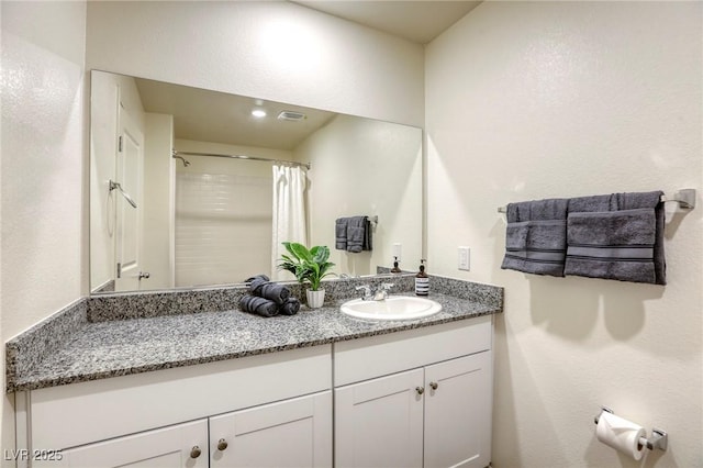 12728 Feathersong St, Henderson, NV 89044 - bathroom featuring vanity and curtained shower