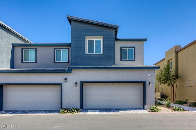 12728 Feathersong St, Henderson, NV 89044 - view of front of property featuring a garage and stucco siding