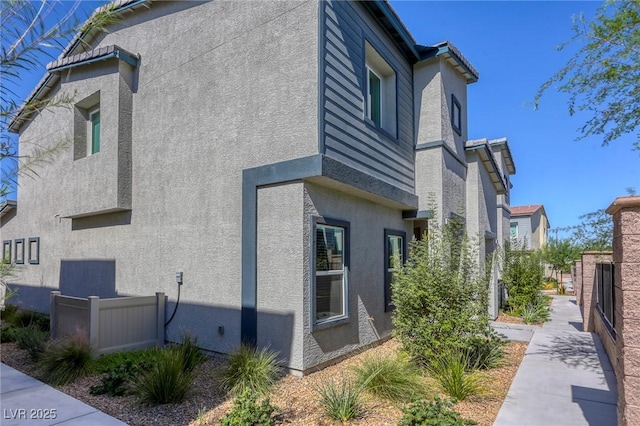 12728 Feathersong St, Henderson, NV 89044 - view of home's exterior with stucco siding