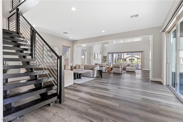 2890 Reverence Heights Ln, Las Vegas, NV 89138 - foyer featuring wood finished floors, stairway, healthy amount of natural light, recessed lighting, and baseboards