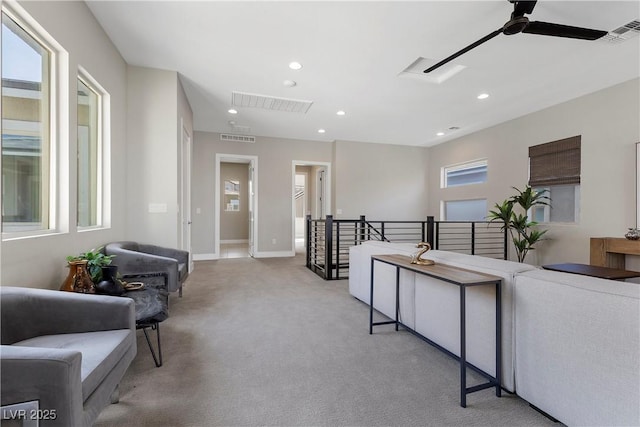 2890 Reverence Heights Ln, Las Vegas, NV 89138 - living area featuring an upstairs landing, carpet, a ceiling fan, recessed lighting, and plenty of natural light