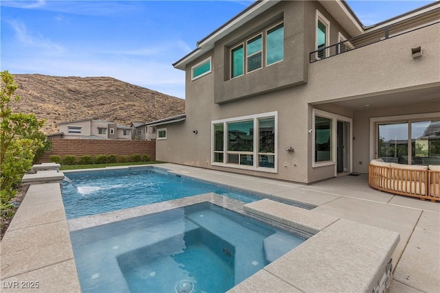 2890 Reverence Heights Ln, Las Vegas, NV 89138 - view of pool featuring a fenced backyard, a patio, a mountain view, and a pool with connected hot tub
