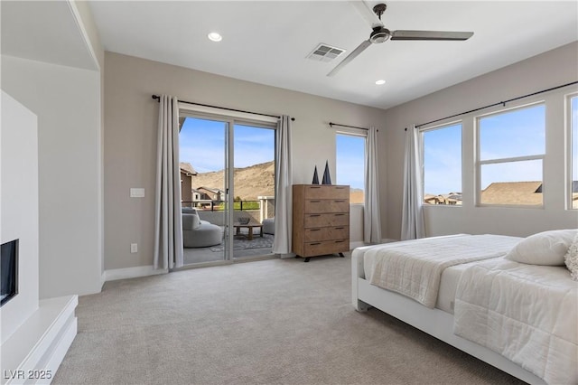 2890 Reverence Heights Ln, Las Vegas, NV 89138 - bedroom with access to outside, multiple windows, light carpet, recessed lighting, and a ceiling fan