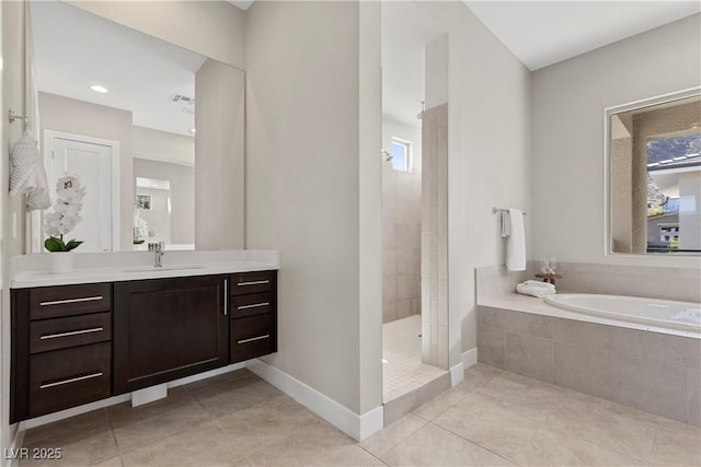 2890 Reverence Heights Ln, Las Vegas, NV 89138 - full bath featuring a garden tub, tile patterned floors, vanity, a walk in shower, and baseboards