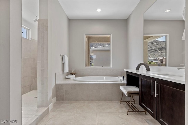 2890 Reverence Heights Ln, Las Vegas, NV 89138 - bathroom with a garden tub, vanity, walk in shower, tile patterned floors, and recessed lighting