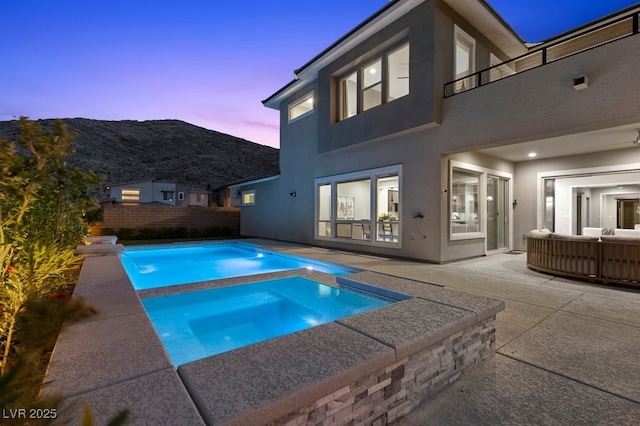 2890 Reverence Heights Ln, Las Vegas, NV 89138 - view of pool with a patio, a mountain view, and a pool with connected hot tub