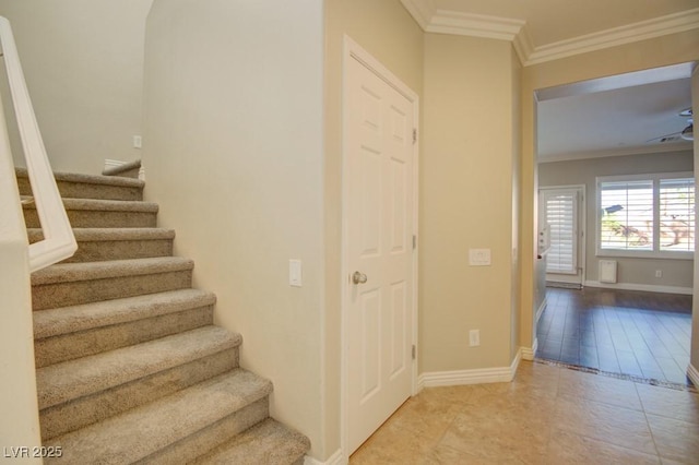 6826 Dovecote Ave, North Las Vegas, NV 89084 - stairway featuring crown molding, tile patterned flooring, and baseboards